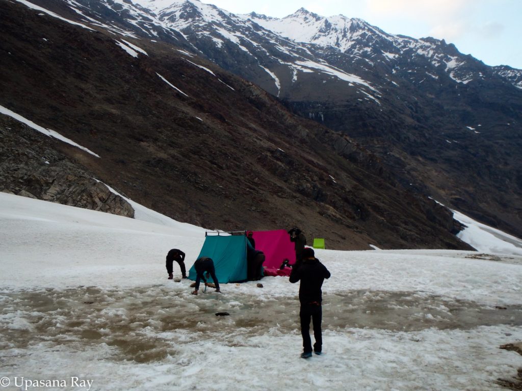 Water pumped out off the glacier beneath the tent......trying to reset the tents [Lamkhaga pass 2018]