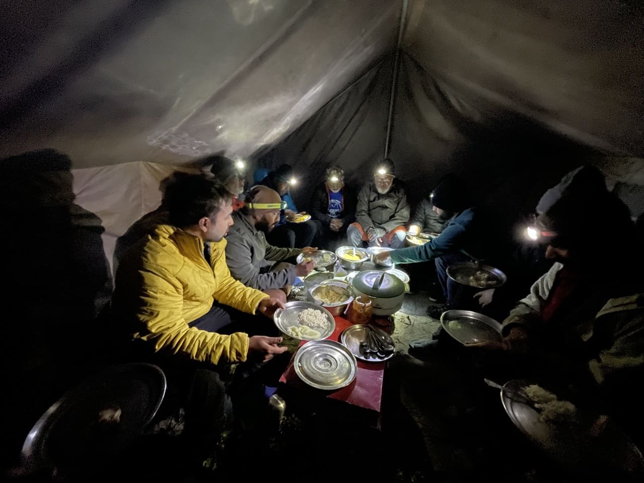 People having dinner at Khatling glacier camp