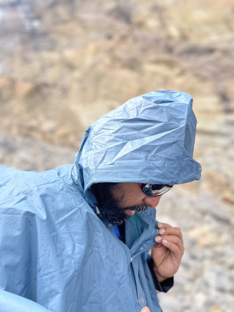 Hiker checking his raincoat