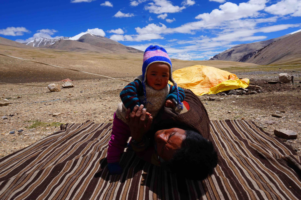 A child playing with his father in Ladakh