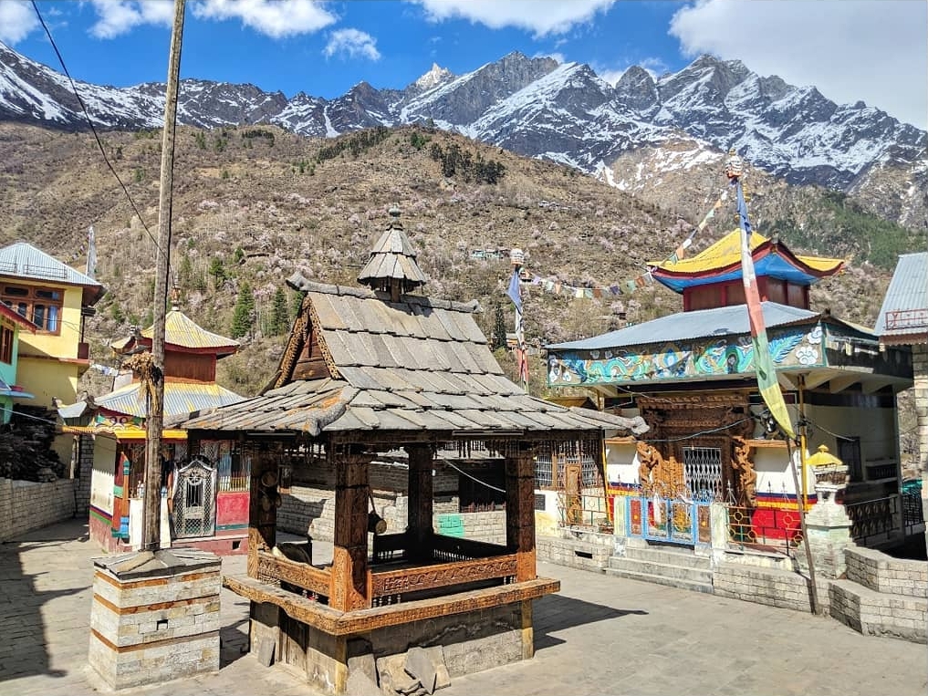 Kamru temple courtyard and mountains in backdrop