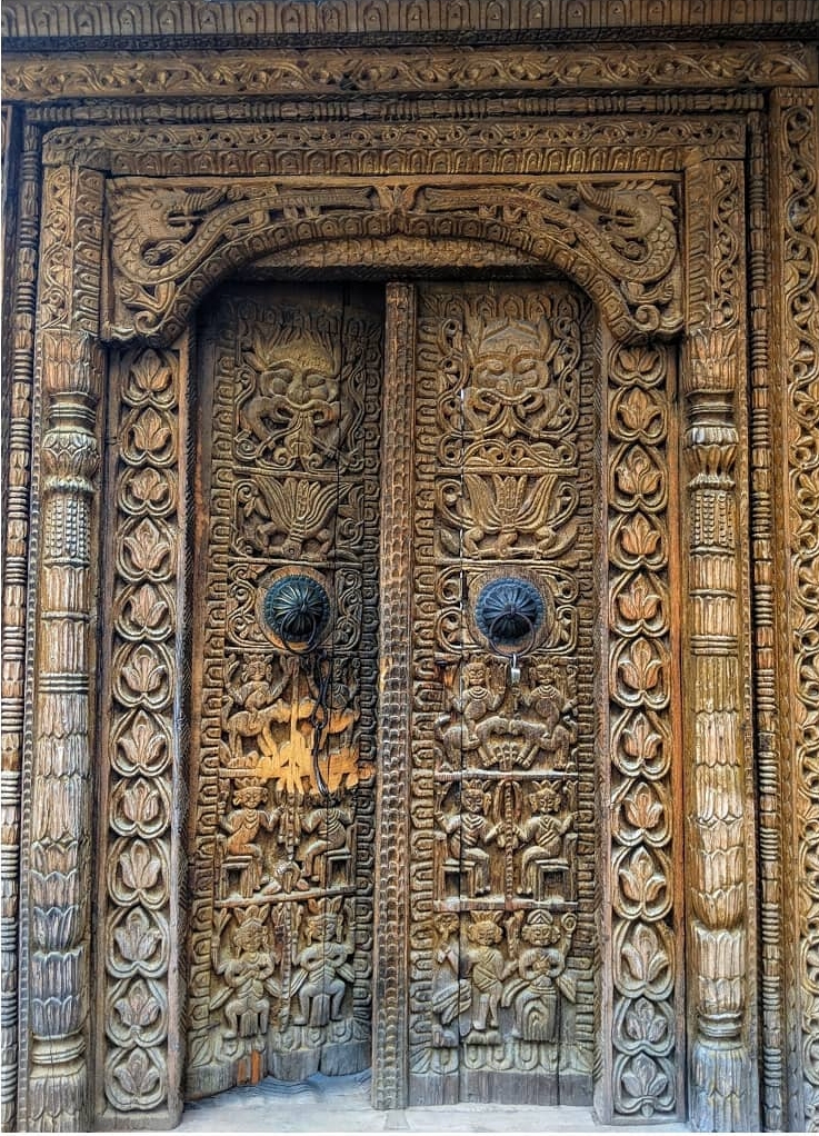 Woord carvings on Kamru fort entrance gate