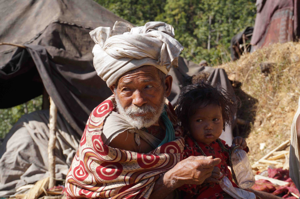 An old Route tribe man with a child