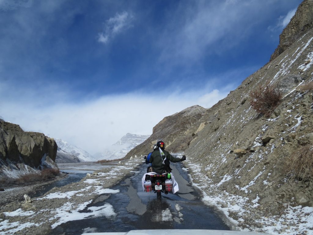 Driving beside the Spiti river during winter